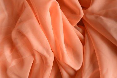 Pembe tül. Tekstil bir yumrunun içine kıvrılıp soyut bir kalıp oluşturuyor. Çok güzel, pastel renkler. Arkaplan olarak dokuyu kullan