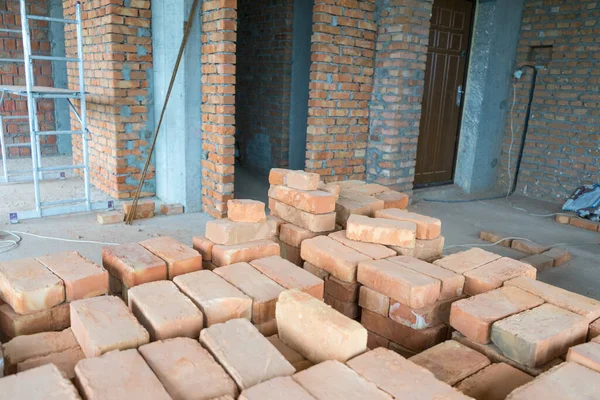 Brickwork of brick, folded in a certain way and fixed with mortar. industrial brick placing brick on cement in the construction of external walls, industry details