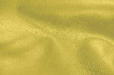 Aydınlatıcı sarı deri dokusu. 2021 giysi ve aksesuarların moda rengi. sahte deri arka plan.