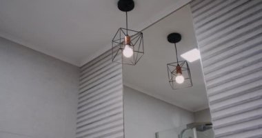 a modern bathroom in the house, sink and mirror.