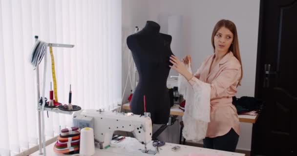 Beautiful fashion woman designer drawing in studio . — Stockvideo
