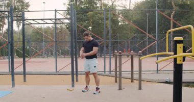 A dedicated man showcases his strength and determination through various workout routines in a vibrant park
