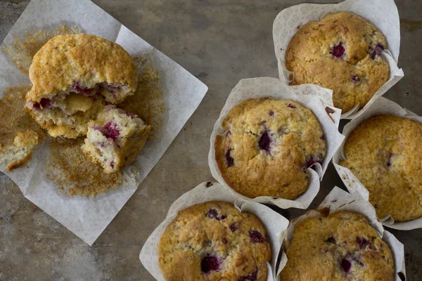 Raspberry Muffins from Above with one Eaten — Stock Photo, Image