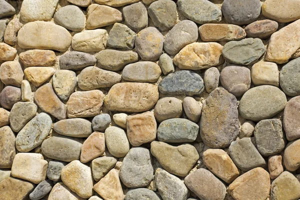 Wall of irregular shaped stones — Stock Photo, Image