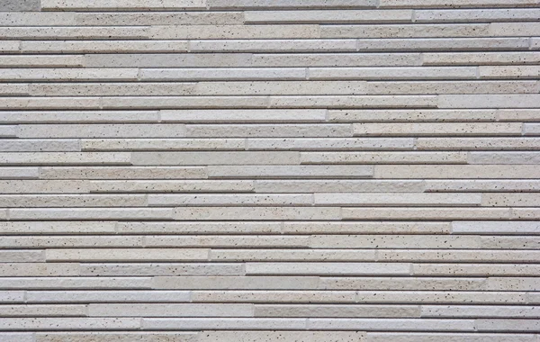 Modern duvar çizgili taş bloklar ile kaplı. Arka plan