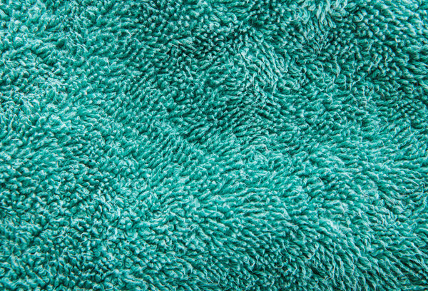 Texture of green terry towel, macro