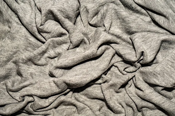 グレーのコットン生地にプリーツ 砕いた灰色の布 — ストック写真