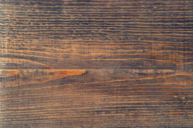 Dokulu ahşap yüzey. Tarla kuşlarının doğal arka planı. Koyu renk. Kaba ahşap doku..