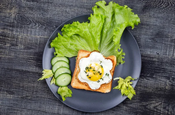 Healthy Restaurant breakfast with fry pan eggs with salad on white background top view