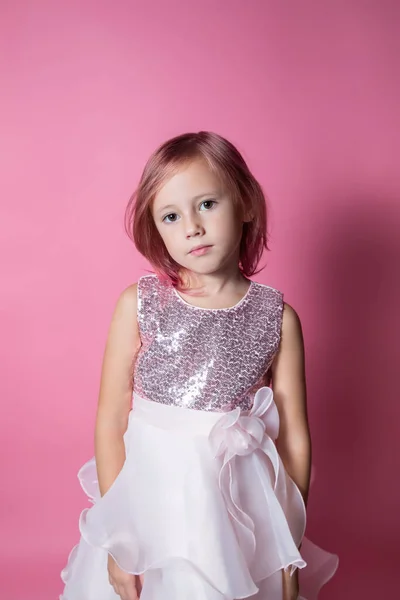Little Caucasian Girl Festive Dress Sequins Posing Pink Background Looking — Stock Photo, Image