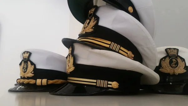 Sombreros militares marinos Imagen de stock