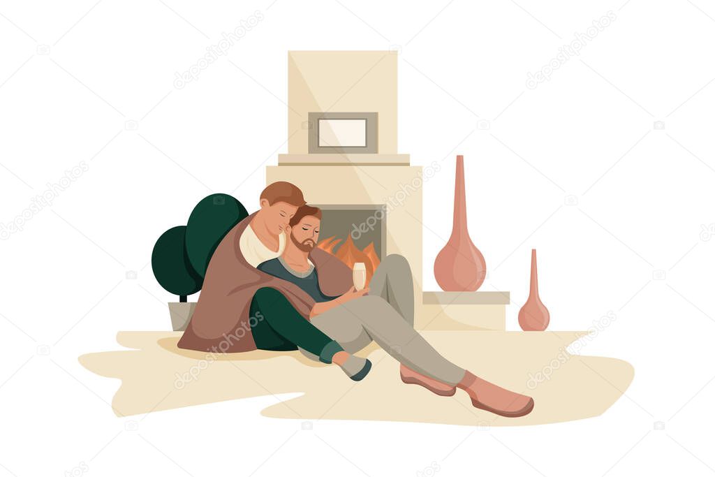 Cute gay couple posing at home, sitting together on the floor and hugging each other.