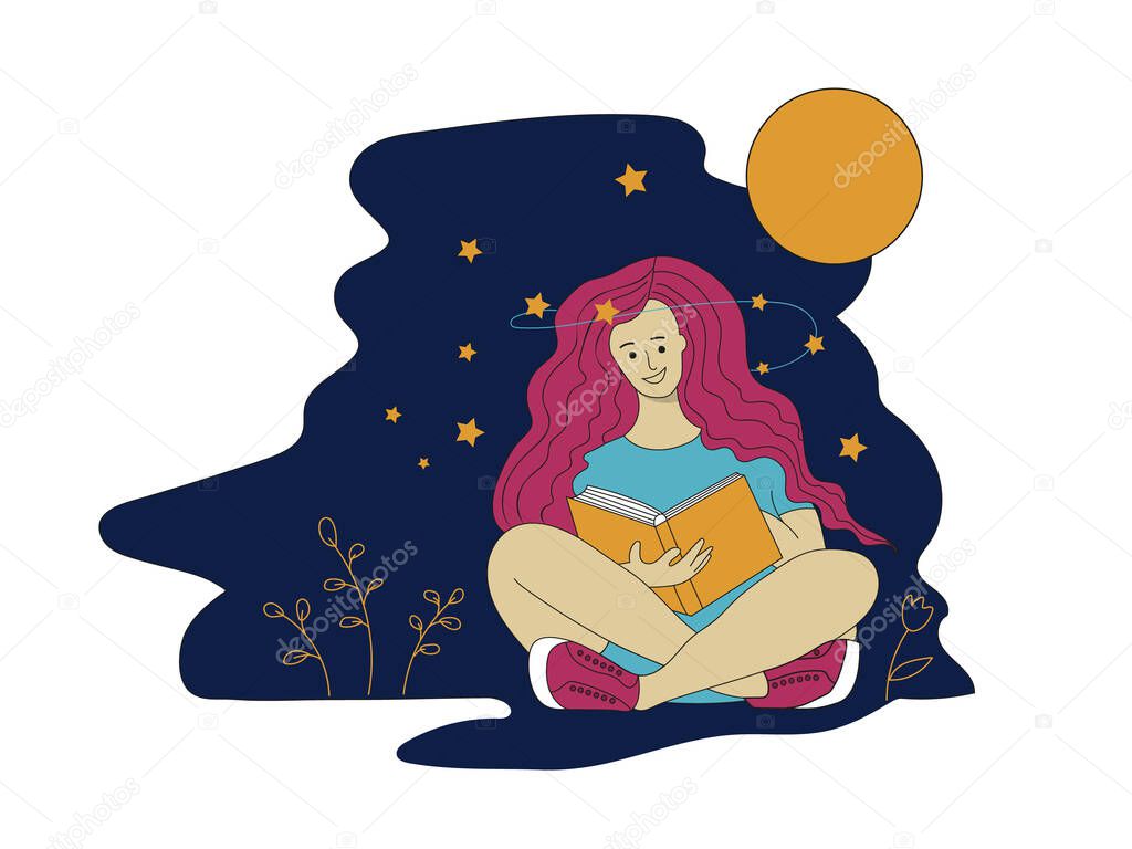 Young girl sitting on the ground reading a book at night
