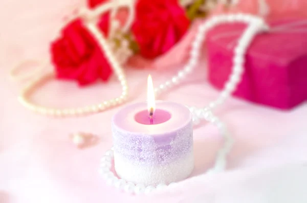 Romantic background - Aroma candle with red rose bouquet and pea — Stock Photo, Image