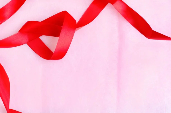 Textura de papel rosa fondo con cinta roja — Foto de Stock