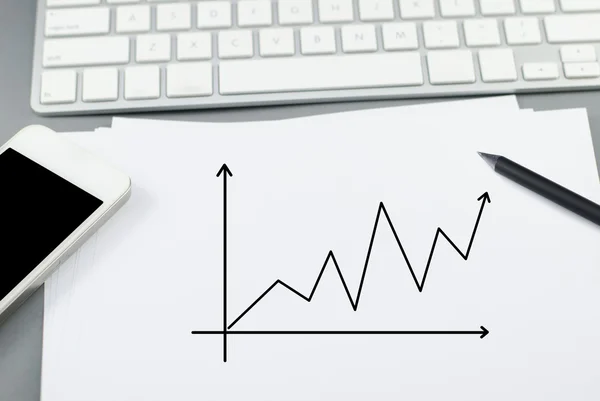 Growth chart on paper with pencil and smart phone on Computer de — Stock Photo, Image