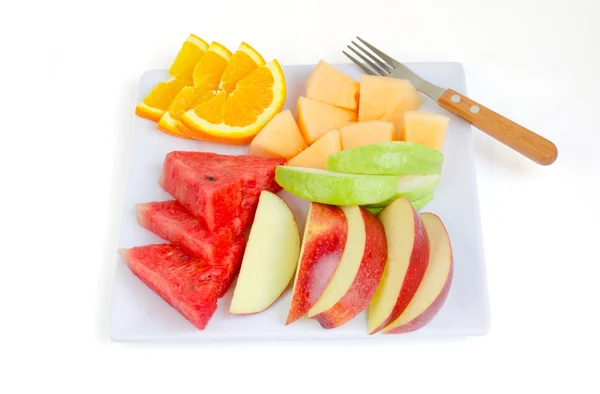新鲜水果中板苹果、 蜜瓜、 西瓜、 橙、 番石榴 w 免版税图库照片