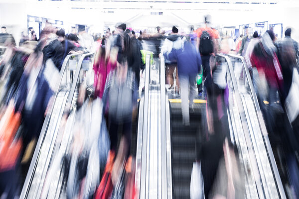Motion blurred crowd people in shopping mall