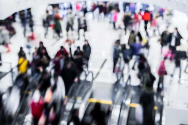 Motion blurred crowded people shopping in mall — Stock Photo, Image