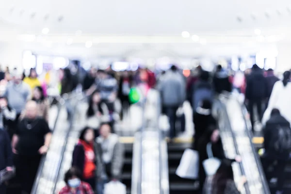 Motion blurred crowded people shopping in mall — Stock Photo, Image