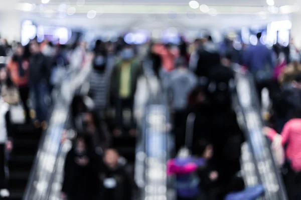 Motion blurred crowded people shopping in mall — Stock Photo, Image