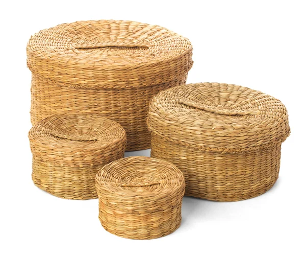Set of four closed wicker baskets on a white background — Stock Photo, Image