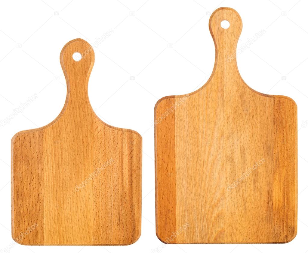 Set of new wooden chopping boards isolated on white