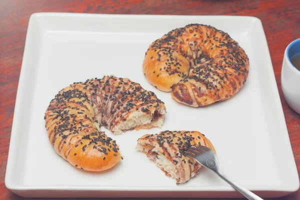 Section piece of croissant bun with black sesame — Stock Photo, Image