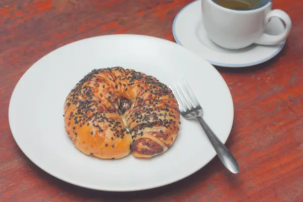 Croissant bun with black sesame topping — Stock Photo, Image