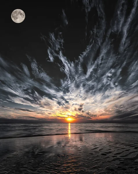 Beautiful sunset on the beach with moon — Stock Photo, Image