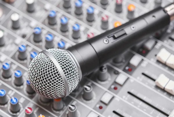 Microphone on sound mixing console — Stock Photo, Image