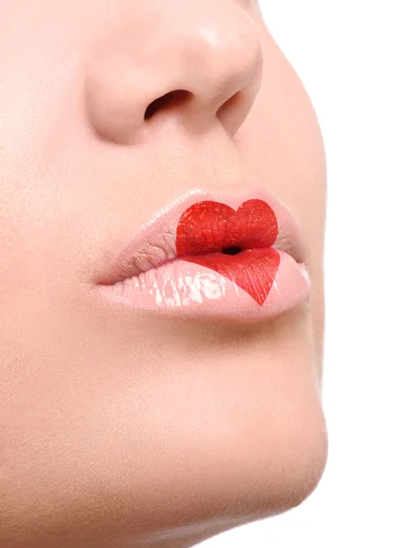 Lovely red make up at the heart shape on lips — Stock Photo, Image