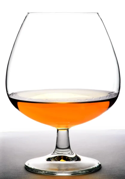 Glass with cognac on white background — Stock Photo, Image