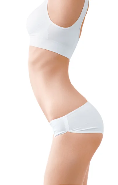 Женщина с идеальным стройным телом в белом белье изолированы на белом . — стоковое фото