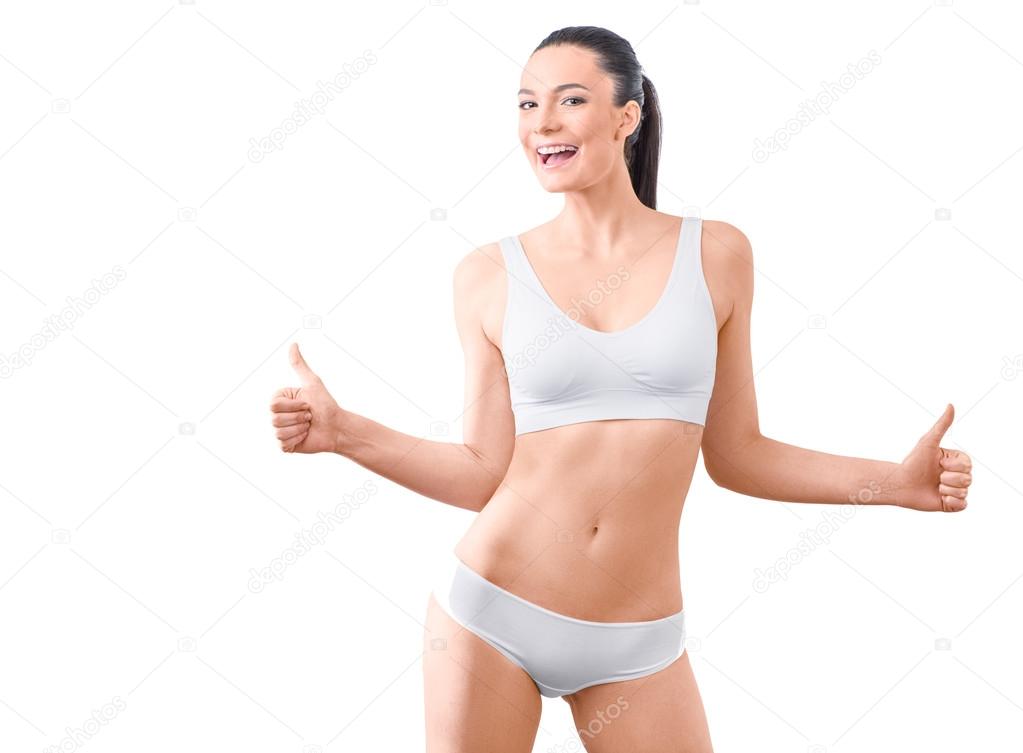 Woman with beautiful slim body posing in underwear on the white background  Stock Photo by ©Chetty 65781839