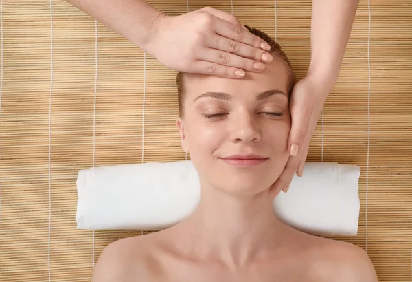 Beautiful young woman getting relaxing head massage. Top view — Stock Photo, Image
