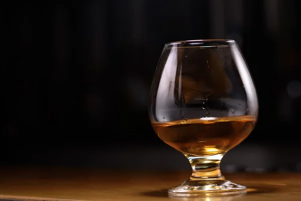 Still life of cognac glass on the bar — Stock Photo, Image