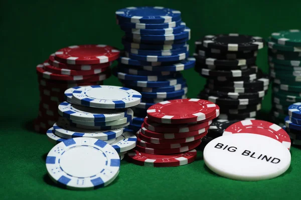 Close up shot of group poker chips on green table — Stock Photo, Image