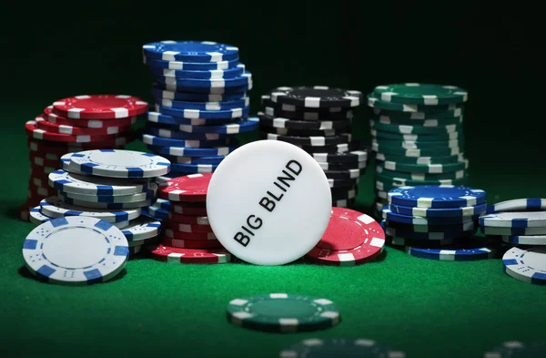 Close up shot of group poker chips on green table — Stock Photo, Image