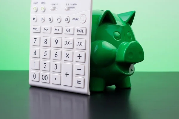 Piggy bank with calculator — Stock Photo, Image