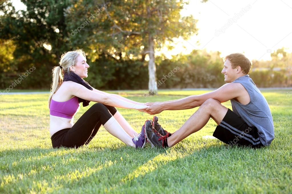 Couple exercising together outside