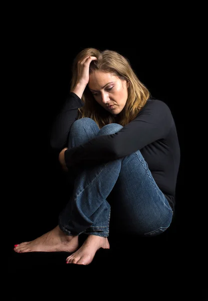 Depressed woman in dark — Stock Photo, Image