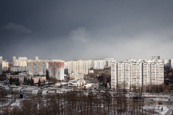 Aerial view of Moscow suburbs in snow storm weather. Horizon, clouds, sky, dramaticsky, light. Soltsevo districs, Moscow, Russia