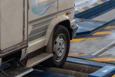 Vehicle going through the brake rollers at an ITV or TUV.