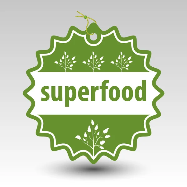 Etichetta del timbro rotondo superfood verde vettoriale con stringa e perlina e con silhouette bianca della pianta — Vettoriale Stock