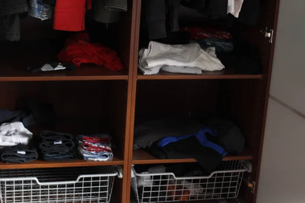 Shirts and jackets in a cupboard