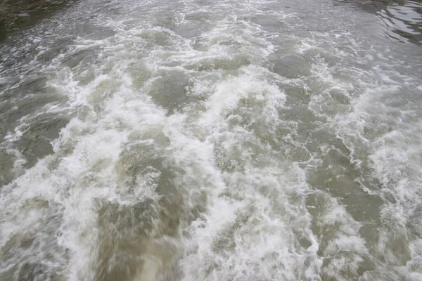 Wake of a boat in the river