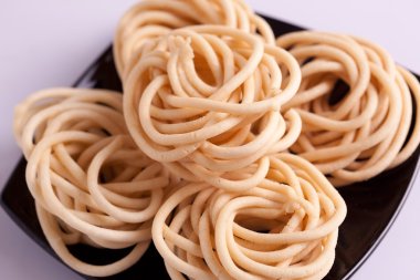 Murukku is a savoury snack popular in South India. clipart
