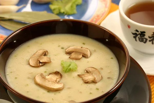 Creme de Mushroom is a soup in which combining the meat and mushrooms in hot water until the flavor extract — Stock Photo, Image