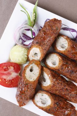 Mixed Kebab - A grilled meat snack from India clipart